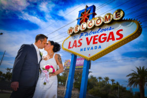Photographers of Las Vegas - Vegas Strip Tour Photography - Wedding Bride and Groom at the Welcome to Las Vegas Sign