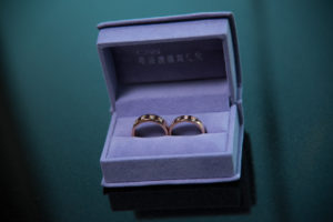Photographers of Las Vegas - Wedding Photography - wedding rings in box on green and black background