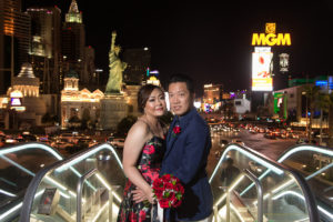 Photographers of Las Vegas - Wedding Photography - wedding couple on bridge with las vegas strip in the background