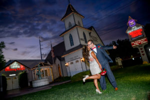 Photographers of Las Vegas - Wedding Photography - wedding couple celebration pose at twilight