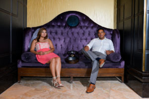 Photographers of Las Vegas - Wedding Photography - wedding couple sitting on couch with phone