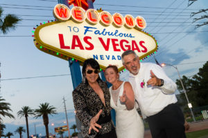 Photographers of Las Vegas - Wedding Photography - wedding couple at Vegas sign with Elvis impersonator