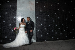 Photographers of Las Vegas - Wedding Photography - wedding couple bride and groom up against stylish wall