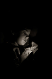 Photographers of Las Vegas - Portrait Photography - boy reading at night