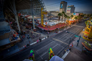 Photographers of Las Vegas - Architectural Photography - downtown las vegas Freemont street experience feet dangling off rooftop
