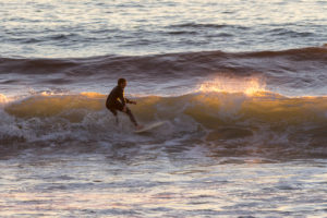 Photographers of Las Vegas - Sports Photography - California surfer on wave at sunset