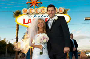Photographers of Las Vegas - Wedding Photography - wedding bride and groom in front of sign background needed removal