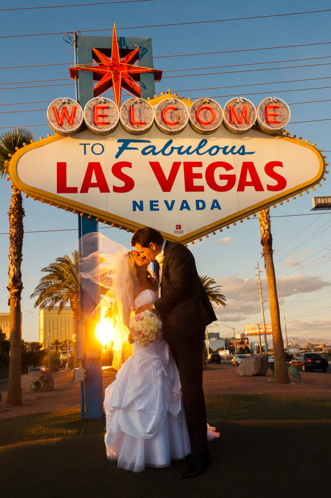 Photographers of Las Vegas - Wedding Photography - wedding couple in front of Vegas sign