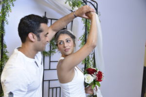 Photographers of Las Vegas - Wedding Photography - Groom spins bride under gazebo