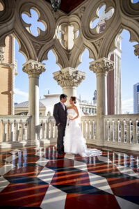 Photographers of Las Vegas - Wedding Photography - Venetian architecture wedding photo with bride and groom