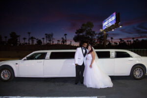 Photographers of Las Vegas - Wedding Photography - wedding photo in front of limousine with bride and groom in Las Vegas