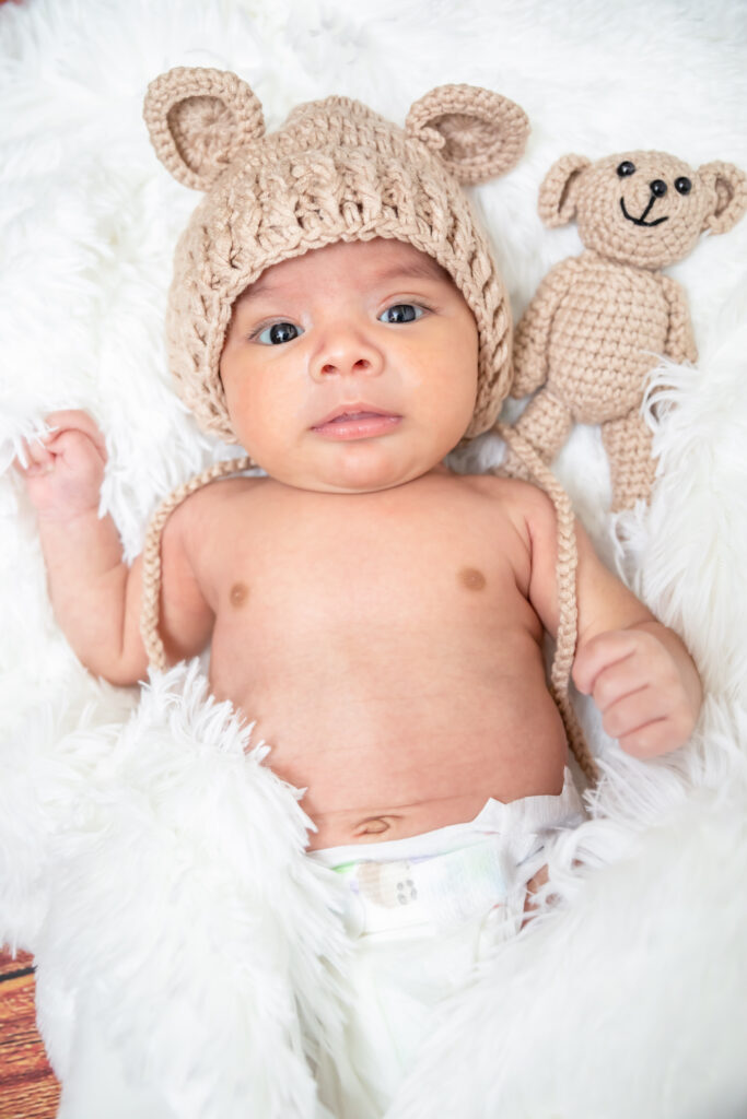 Photographers of Las Vegas – Studio Photography – Newborn Baby White fuzzy blanket teddy bear