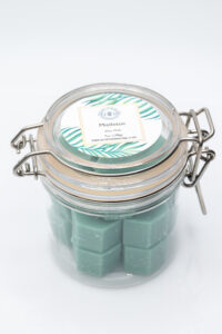 Photographers of Las Vegas – Studio Product Photography – Green Wax Melts Glass Jar White Backdrop