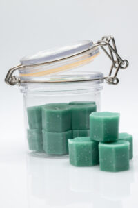 Photographers of Las Vegas – Studio Product Photography – Green Wax Melts Clear Jar White Backdrop