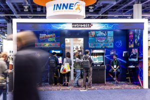 Photographers Of Las Vegas - Event Photography - Convention people walking blur retro-bit video game arcade machine playing Innex innovative accessories