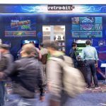 Photographers Of Las Vegas - Event Photography - Convention people walking blur retro-bit video game arcade machine