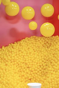 Photographers Of Las Vegas - Commercial Photography - Yellow balls hanging ball pit pool pink background
