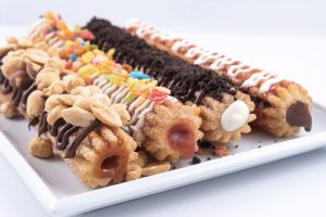 Photographers Of Las Vegas - Churros filled inside sweet toppings white plate