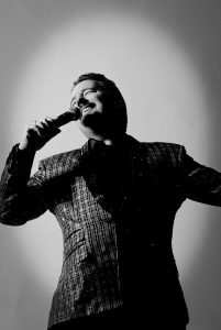Photographers Of Las Vegas - Still Life Photography - Guy singing performing black and white photo