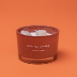 Photographers Of Las Vegas - Commercial Photography -White Candle crystal stones in wax orange background scented candle relax at home