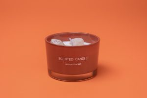 Photographers Of Las Vegas - Commercial Photography -White Candle crystal stones in wax orange background scented candle relax at home