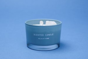 Photographers Of Las Vegas - Commercial Photography -White Candle crystal stones in wax blue background scented candle relax at home