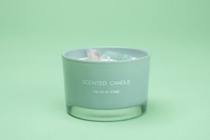 Photographers Of Las Vegas - Commercial Photography -White Candle crystal stones in wax mint green background scented candle relax at home
