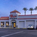 Photographers Of Las Vegas - Commercial Photography - Restaurant Rburgers red neon lights cars parking lot food daytime palm trees
