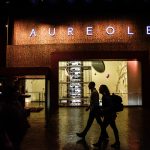 Photographers Of Las Vegas - Commercial Photography - Storefront Aureole pattern walking silhouette man woman