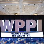 Photographers Of Las Vegas - Event Photography - WPPI convention big sign white letters blue rug