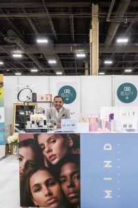 Photographers Of Las Vegas - Event Photography - Man displaying Cbd Beauty products convention booth Mind naturals