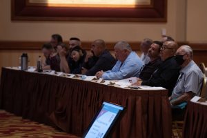 Photographers Of Las Vegas - Event Photography - Men audience sitting listening