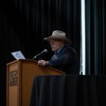 Photographers Of Las Vegas - Event Photography - Man speaking on stage cowboy hat south point