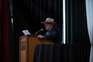 Photographers Of Las Vegas - Event Photography - Man speaking on stage cowboy hat south point