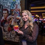 Photographers Of Las Vegas - Event Photography - Convention business shipt woman posing cocktail drink orange