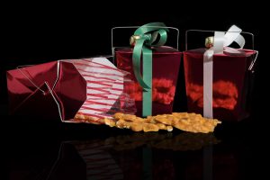 Photographers Of Las Vegas - Commercial Photography - Red boxes with treats bow bell black background