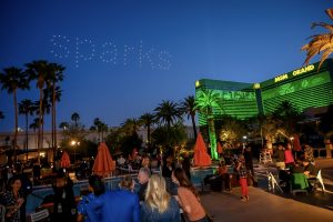 Photographers Of Las Vegas - Event Photography - Sparks lights sky MGM Grand green pool party orange umbrellas