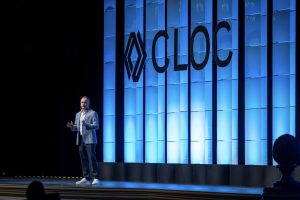 Photographers Of Las Vegas - Event Photography - Presentation Cloc blue stage man speaking