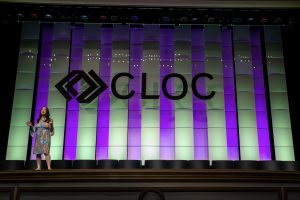 Photographers Of Las Vegas - Event Photography - Convention Cloc presentation woman on stage speaking