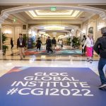 Photographers Of Las Vegas - Event Photography - Convention Cloc global institute 2022 hallway people walking badges