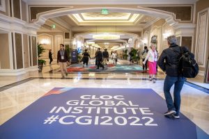 Photographers Of Las Vegas - Event Photography - Convention Cloc global institute 2022 hallway people walking badges