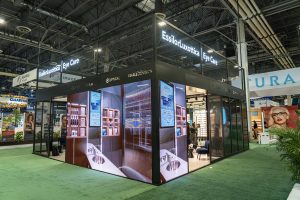 Photographers Of Las Vegas - Event Photography - Convention booth eye care neon lights black metal frame