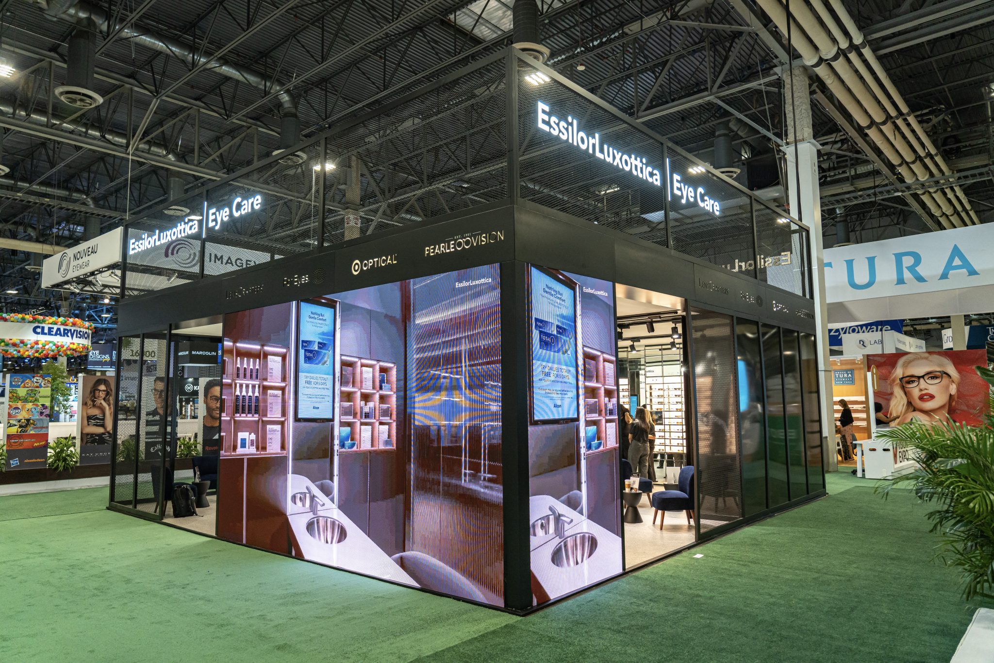 Photographers Of Las Vegas - Event Photography - Convention booth eye care neon lights black metal frame