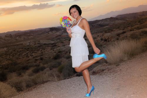 Photographers of Las Vegas - Wedding Photography - wedding bride at valley of fire bride grabbing heel