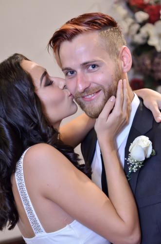 Photographers of Las Vegas - Wedding Photography - wedding couple bride kisses grooms cheek