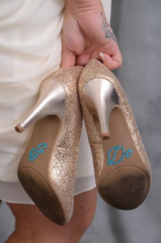 Photographers of Las Vegas - Wedding Photography - wedding bride holding I do shoes