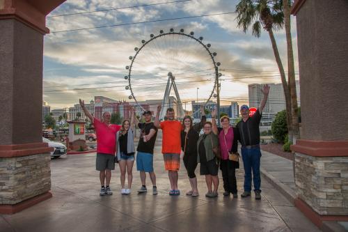 Photographers of Las Vegas - Portrait Photography - group photo at sunset with ferris wheel