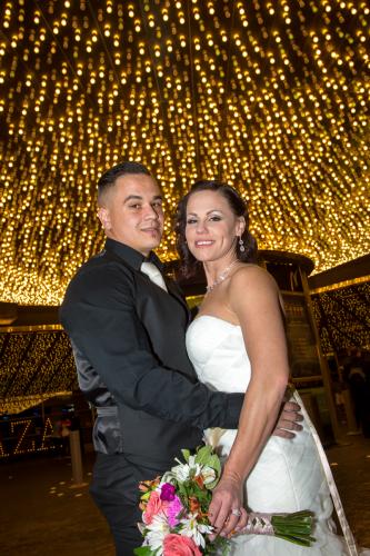 Photographers of Las Vegas - Wedding Photography - wedding couple under Vegas lights at plaza hotel