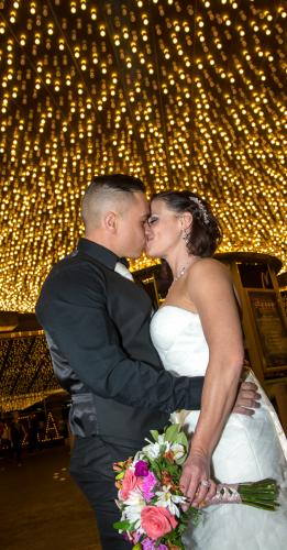 Photographers of Las Vegas - Wedding Photography - wedding couple kiss under Vegas lights