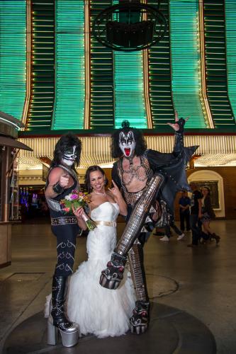 Photographers of Las Vegas - Wedding Photography - wedding bride with rock and roll kiss impersonators